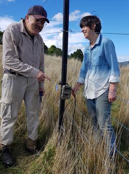 Rose and Arnold installing a wildlife camera