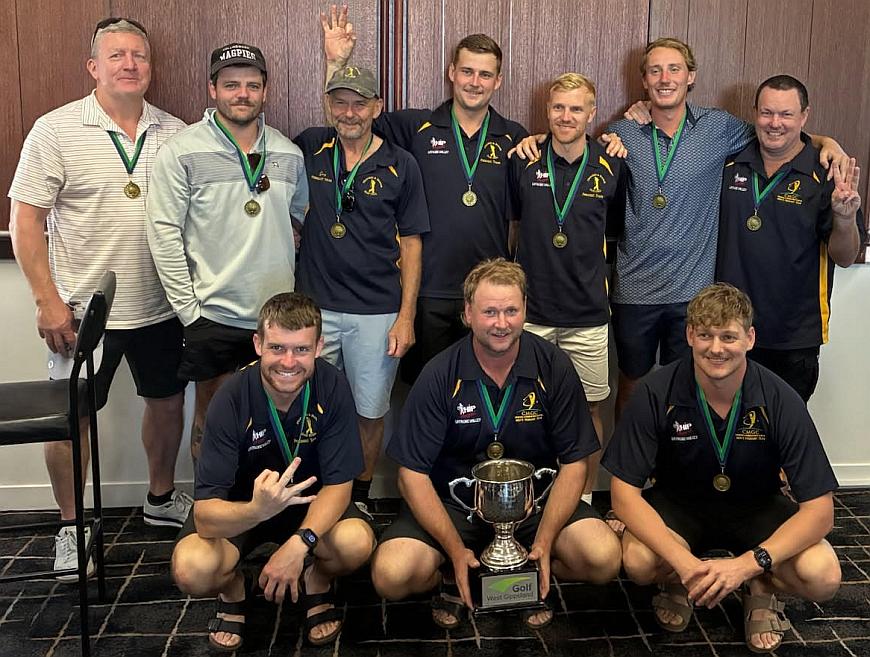 The team showing medals and the cup
