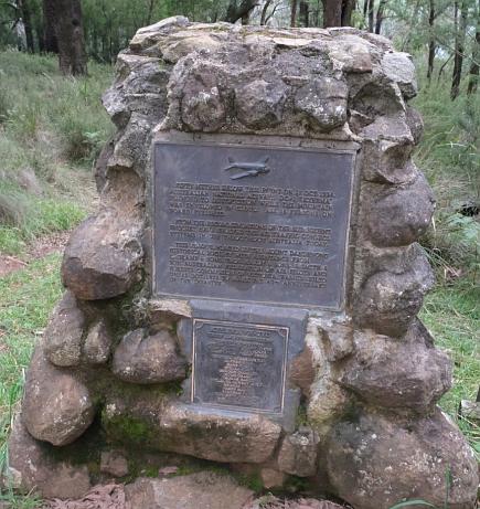 Brass plaque set into stone plinth as memorial