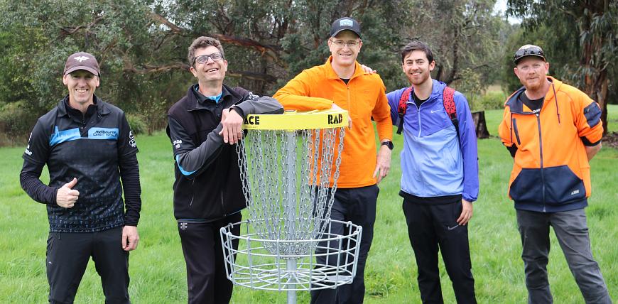 Players around a fick golf target